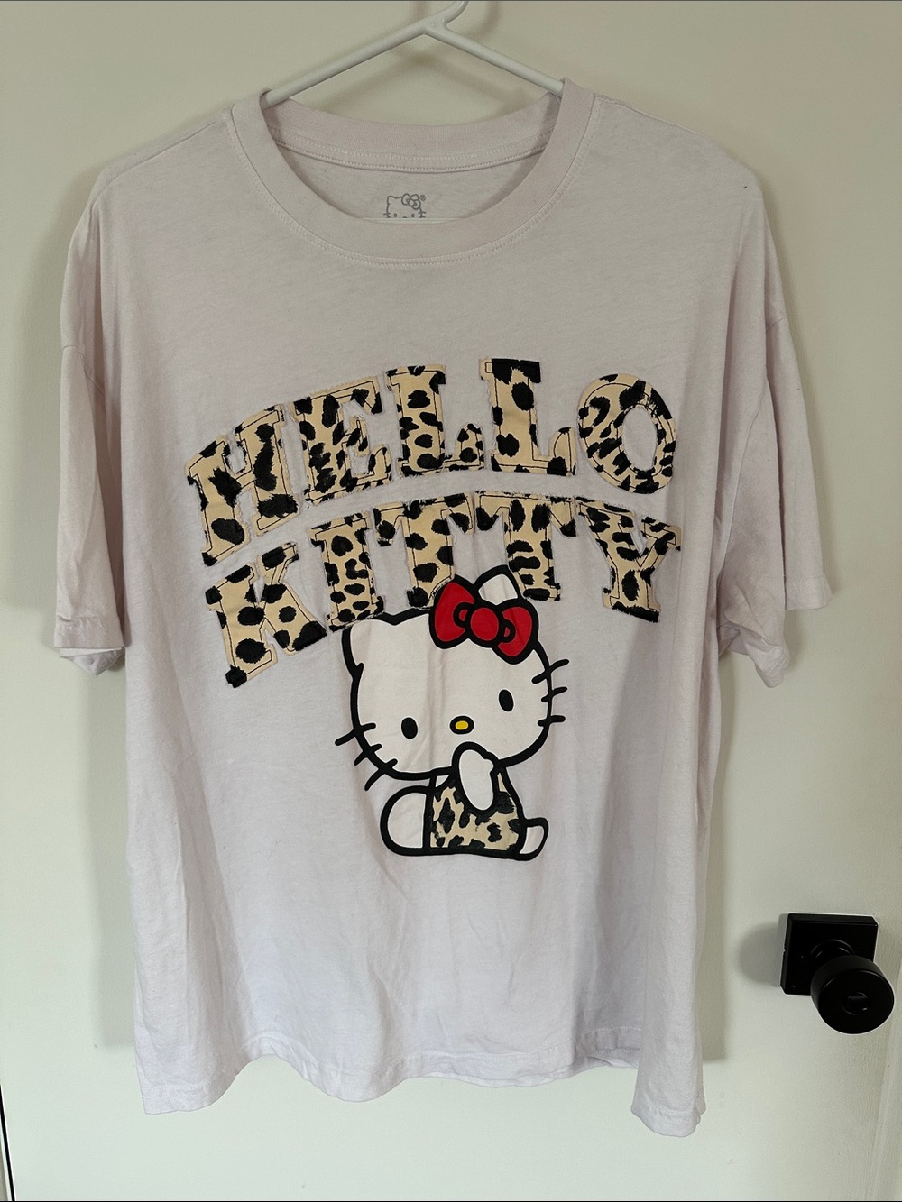Hello Kitty Light Pink Tee with Leopard Print and Red Bow